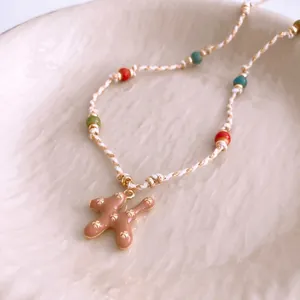 Pastel ceramic dog pendant necklace with colorful beads and woven cotton rope