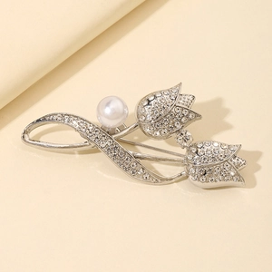 Elegant silver tulip brooch with sparkling rhinestones and a central pearl accent