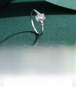 Detail of 1 carat rectangular cut cubic zirconia ring with hand-set micro pavé stones