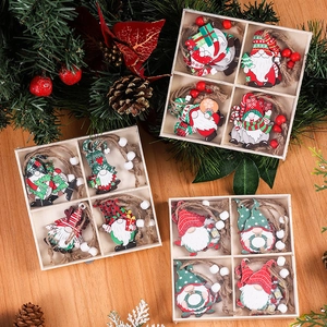 Set of 12 festive wooden Christmas gnome ornaments with colorful beads and hanging ropes