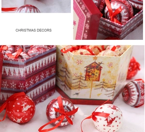 Christmas ornament set with elk and snowflake patterns in a gift box on plush background
