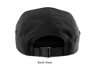 Detail view of the adjustable plastic buckle and nylon strap on a black five-panel cap
