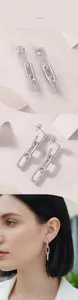 Detail van S925 zilveren schakeloorbellen met pavé moissaniet en spiegelglans afwerking