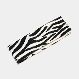 Detailed knit texture of a black and white zebra pattern elastic sports headband