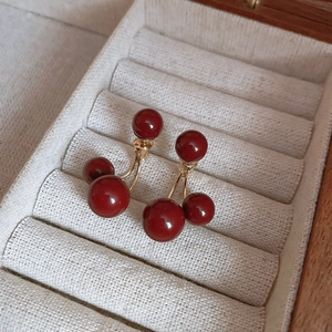 Elegant cherry-shaped earrings with red resin beads and gold-finished hooks