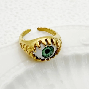 Adjustable gold ring featuring a realistic green evil eye design in a trendy style