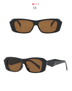 Detail of geometric thick frame sunglasses with faceted temples and dark brown lenses