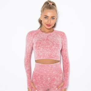 Pink acid wash yoga set featuring long sleeve crop top with thumbholes and leggings