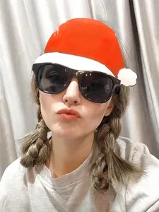 Close-up of black frame party sunglasses worn by a person for Christmas celebrations