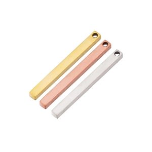 Close-up of three rectangle bar pendants in gold, rose gold and silver stainless steel