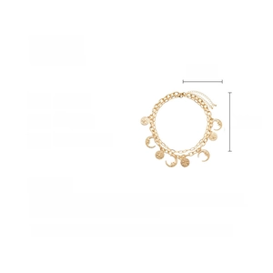 Detailed view of gold sun and moon pendants on a layered alloy metal necklace