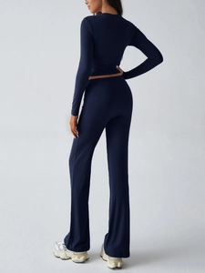 Back view of slim fit navy blue Y2K tracksuit featuring cropped top and flared pants