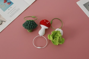 Handmade crochet charms set including broccoli, mushroom, and cabbage with steel keyrings