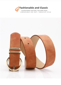 Detail of amber leather belt featuring a textured nubuck finish and golden horseshoe buckle