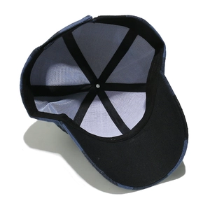 Internal view of denim baseball cap showing reinforced seams and black sweatband