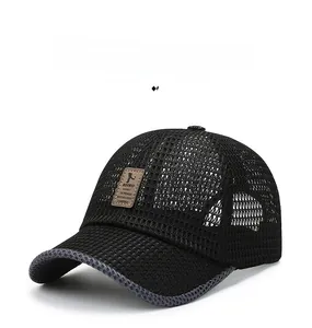 Close-up of a breathable black mesh baseball cap with a brown leather logo patch details