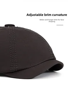 Detail of cotton newsboy cap showing its flexible foldable brim and wide face-framing design
