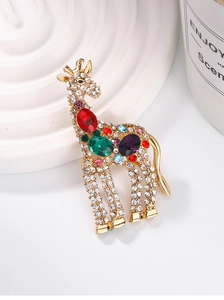 Detailed close-up of giraffe brooch with colorful gemstones and pavé crystals