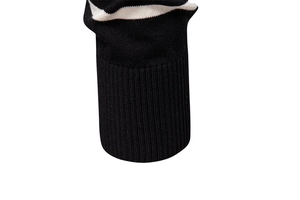 Detail of high-density ribbed cuff on men's striped knit polo with white accents