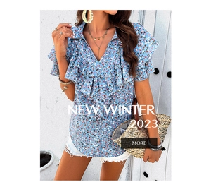 Close-up of blue floral V-neck blouse with ruffle sleeves and elegant printed patterns