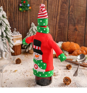 Detailed view of knitted snowman wine bottle cover with hat for Christmas decor