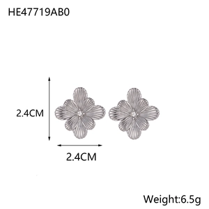 Detailed view of silver sunflower stud earrings measuring 2.4cm with white rhinestone center