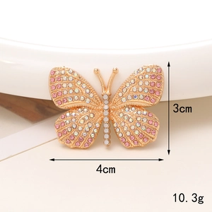 Detail shot of a 4x3cm rhinestone butterfly charm with pink crystals and 10.3g weight