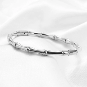 Macro shot of 5mm bamboo node style stainless steel bracelet with mirror polished finish