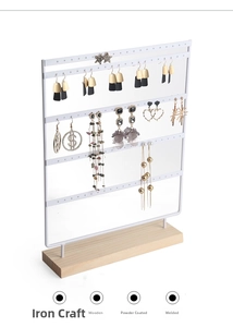Detailed view of white 5-tier earring organizer rack with sturdy wooden base