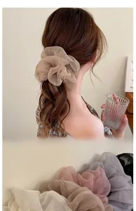 Close-up of soft chiffon oversized scrunchies in various elegant pastel shades