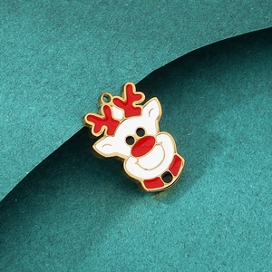 Macro view of Christmas reindeer enamel pendant with gold trim for DIY jewelry