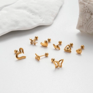 Set of 8 gold stainless steel cartilage earrings with heart, butterfly and snake designs
