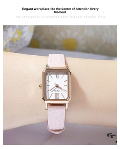 Elegant rectangular rose gold watch with pink leather strap shown on a woman's wrist