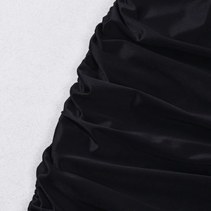 Detail of black elastic knit fabric with sophisticated ruched textures and smooth finish