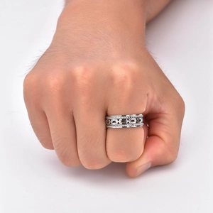 Detailed view of silver titanium steel cable ring with hollow Cuban chain pattern