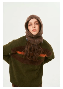Detail of green knit sweater with plush stripes and matching winter balaclava hood