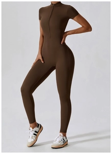 Close-up of dark brown short-sleeve yoga jumpsuit with zipper collar and sleek fit
