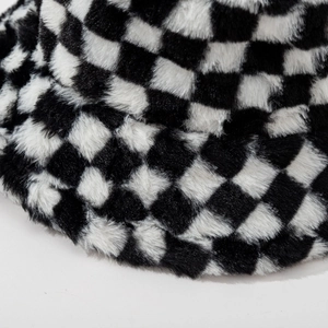 Classic black and white checkered faux fur bucket hat with thick plush texture for winter