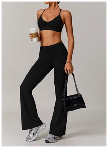 Close-up of black quick-dry V-neck yoga bra and flared leggings for fitness