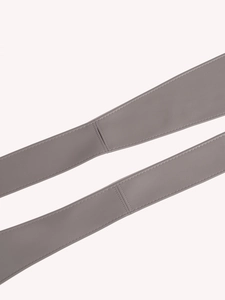 Detail of grey synthetic leather waist belt showing fine texture and reinforced stitching