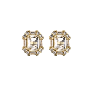 Elegant gold emerald-cut zircon stud earrings with halo crystals on white background