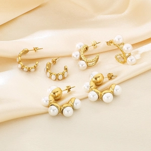 Detailed collection of five golden C-shaped stainless steel earrings with white pearls