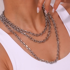Three-layer silver chunky chain necklace in stainless steel shown on a fashion model