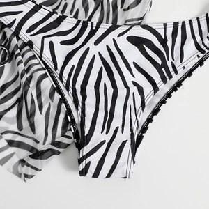 Detail of zebra print bikini bottoms and matching sheer mesh sarong cover-up