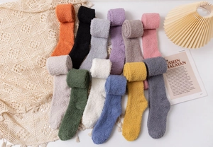 Detailed flat lay of colorful coral fleece over-knee socks in twelve solid vibrant tones