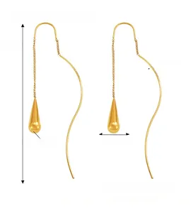 Detailed view of long stainless steel tassel earrings with smooth golden teardrop pendants