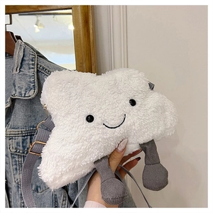 Close-up of white plush cloud crossbody bag with smiley face and dangling grey legs