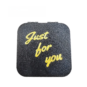 Close-up of a black leather texture gift box featuring Just for you yellow lettering