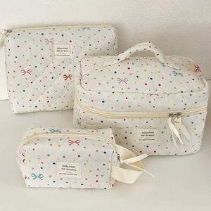Three-piece quilted makeup bag set with colorful polka dots and cute bow patterns