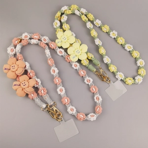 Handmade woven crossbody phone lanyards with colorful daisy floral patterns and smile charms